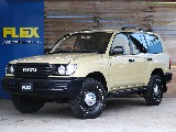 ランドクルーザー１００、VXリミテッドのガソリン車が丸目フェイス換装のカスタム車で入庫です！