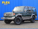 平成11年式　ランクル70 ディーゼル 4WD ５速マニュアル　グリーン　丸目・ロールーフ換装　走行19.5万キロ車両の紹介です。