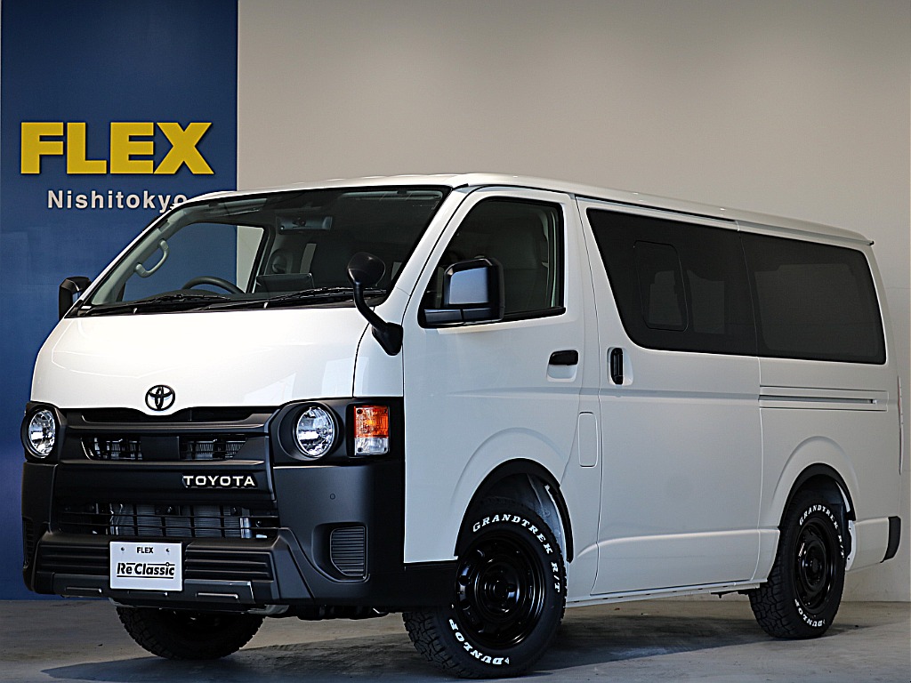 新車ハイエースＶ人気のＤＸロングＲＥクラシック丸目ライトフェイチェンジ済み！オリジナルフロントバンパーオリジナル１６インチアルミオリジナルオーバーフェンダーリア全面床張り施工オリジナルベットＫＩＴ装備